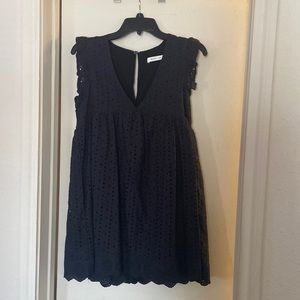 Black mini dress with eyelet detailing by Mustard seed.